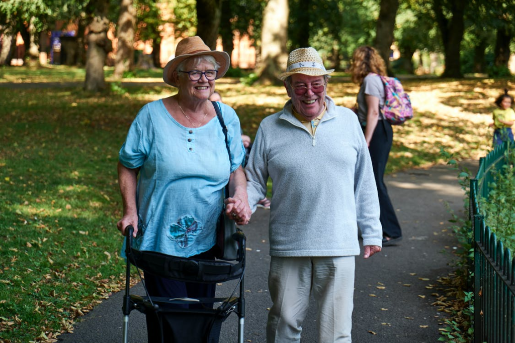 Two older adults taking a walk together.