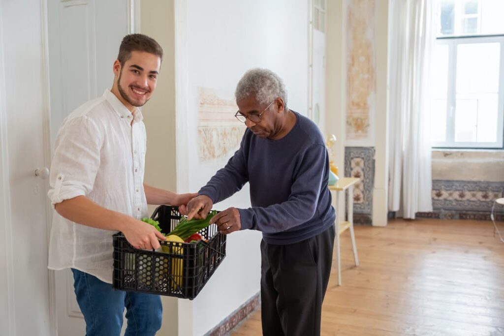 A home caregiver assisting an elderly person