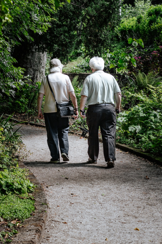 Two senior adults on a walk.