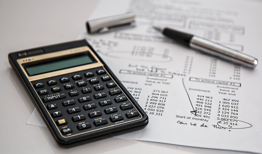 A calculator and a budget sheet