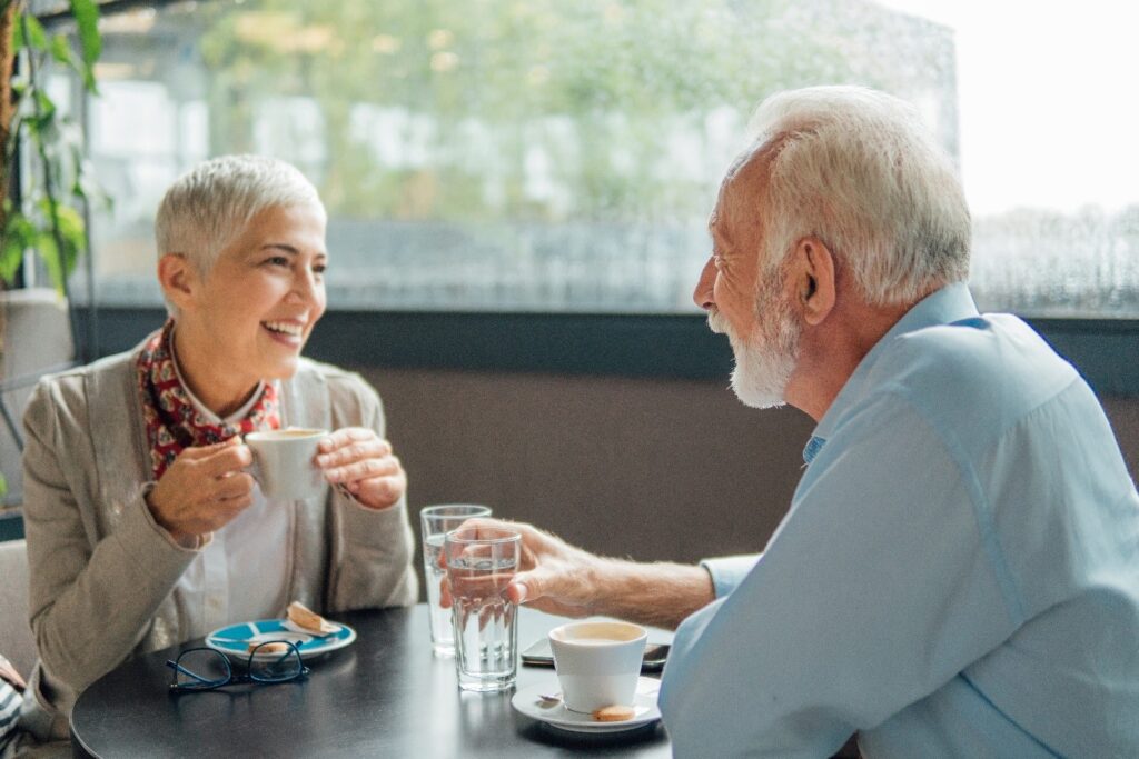 A senior couple smiling at each other