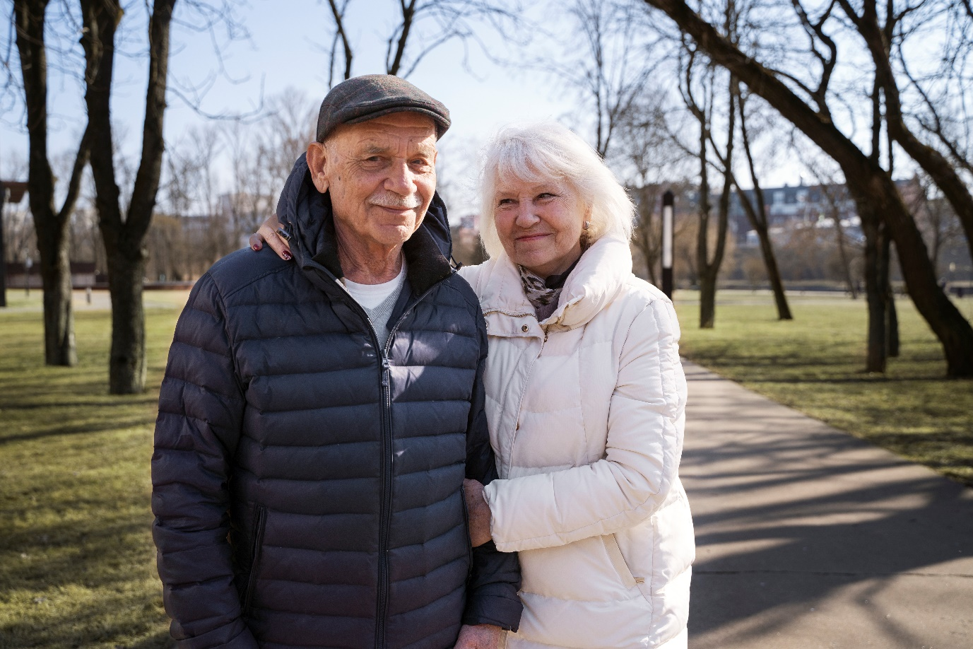 a senior couple walking in a park